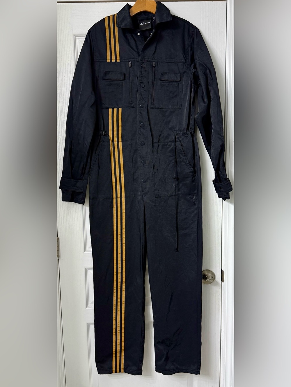 Women's Black Jumpsuit with Gold Stripe